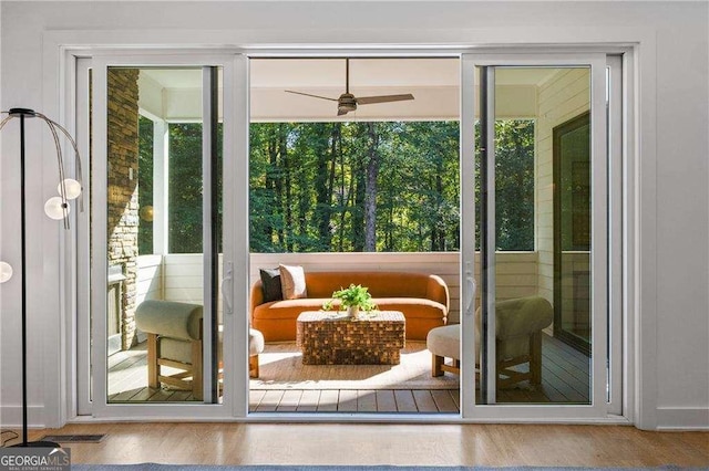 entryway with ceiling fan and hardwood / wood-style flooring