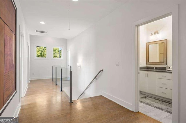 corridor featuring light hardwood / wood-style floors