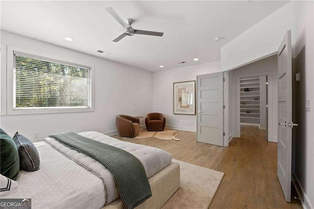 bedroom featuring ceiling fan and wood-type flooring