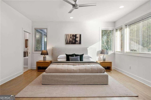 bedroom with ceiling fan and light hardwood / wood-style flooring