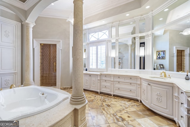 5200 Moore Rd, Suwanee, GA 30024 - full bath with decorative columns, crown molding, vanity, a garden tub, and recessed lighting