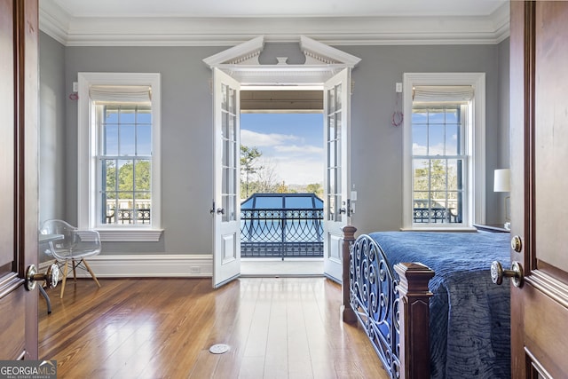 5200 Moore Rd, Suwanee, GA 30024 - bedroom with wood-type flooring, access to outside, ornamental molding, baseboards, and a baseboard heating unit