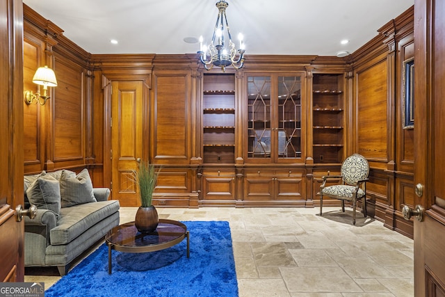 5200 Moore Rd, Suwanee, GA 30024 - sitting room with stone tile flooring, a chandelier, and recessed lighting