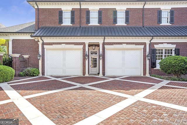 5200 Moore Rd, Suwanee, GA 30024 - view of property with brick siding, driveway, and an attached garage