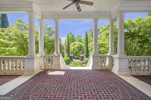 5200 Moore Rd, Suwanee, GA 30024 - view of patio featuring covered porch, a ceiling fan, and view of wooded area