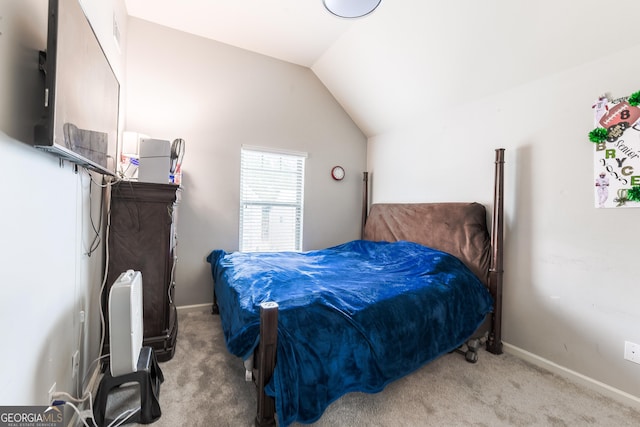 carpeted bedroom featuring vaulted ceiling