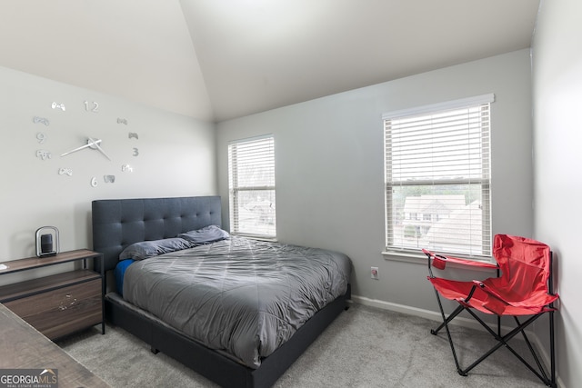 carpeted bedroom featuring vaulted ceiling