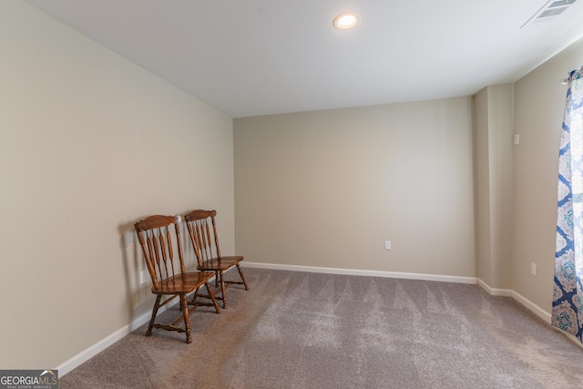 sitting room with carpet flooring