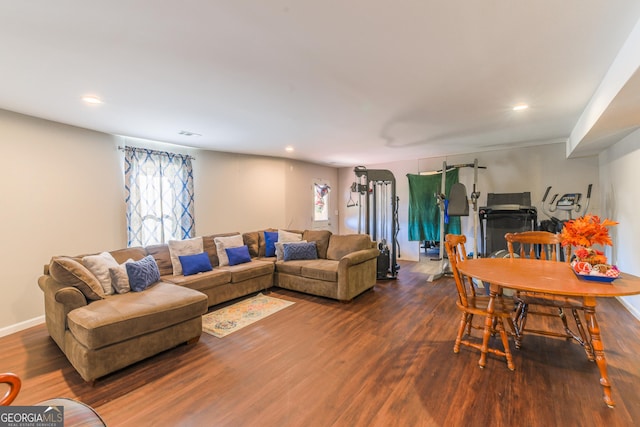 living room with dark hardwood / wood-style flooring