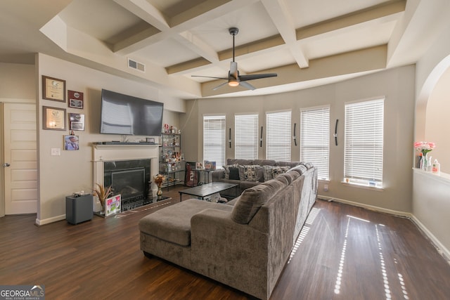 living room featuring coffered ceiling, beamed ceiling, ceiling fan, and dark wood-type flooring