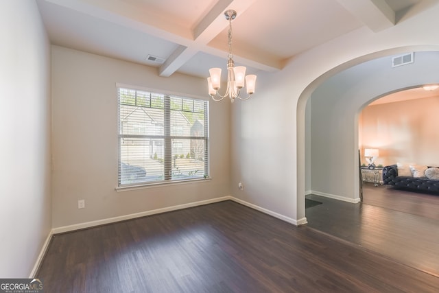 unfurnished room featuring coffered ceiling, dark wood-type flooring, beamed ceiling, and an inviting chandelier