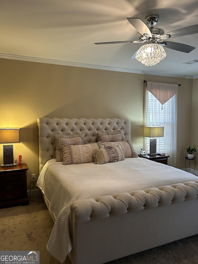 carpeted bedroom featuring crown molding and ceiling fan