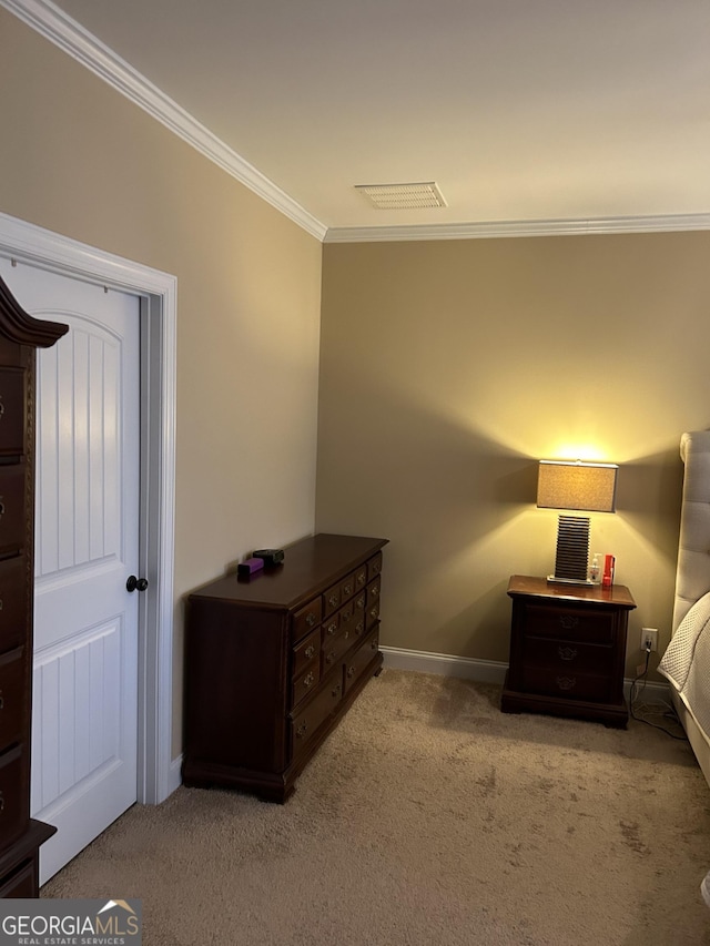 carpeted bedroom with ornamental molding