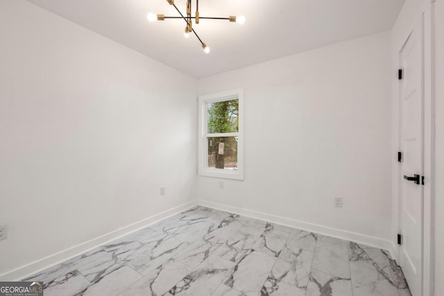 unfurnished room featuring a notable chandelier