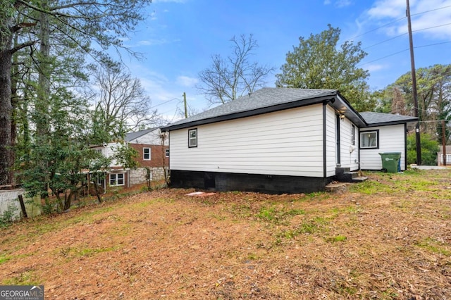 view of side of property featuring a yard