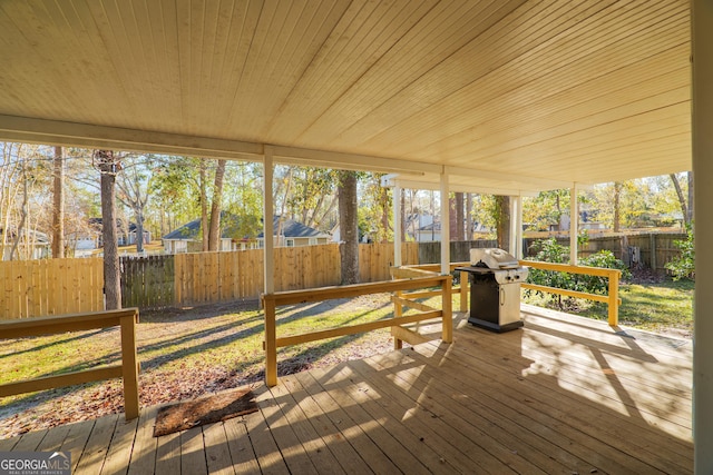 sunroom / solarium with wood ceiling and a healthy amount of sunlight