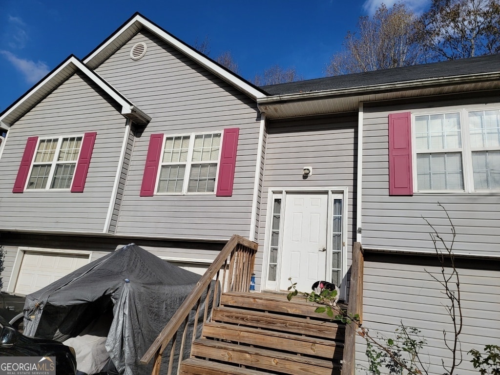 view of front of property with a garage