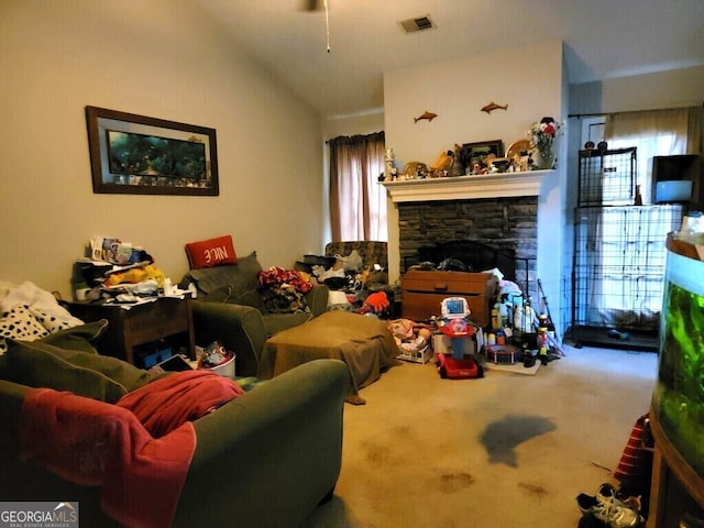 carpeted living room with vaulted ceiling and a stone fireplace