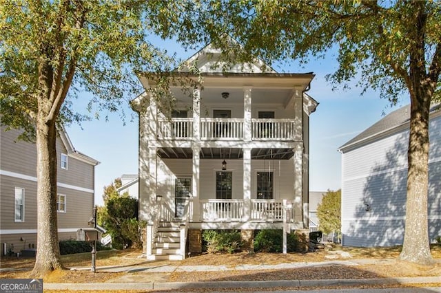 view of front of house featuring covered porch and a balcony