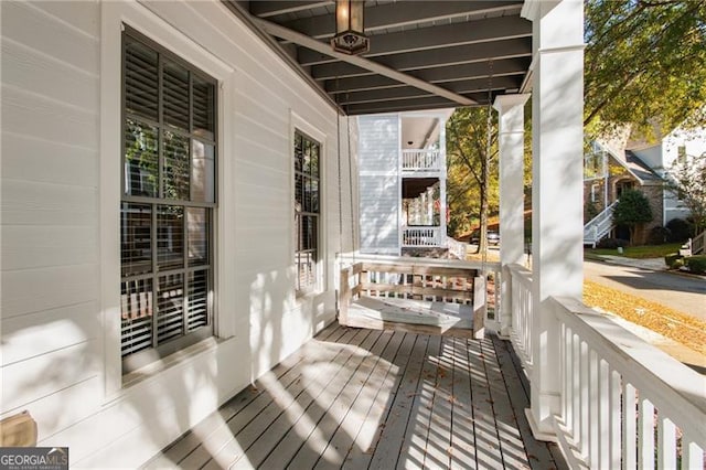 wooden deck featuring covered porch