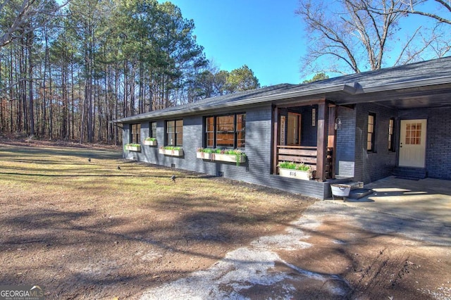 view of side of property with a yard