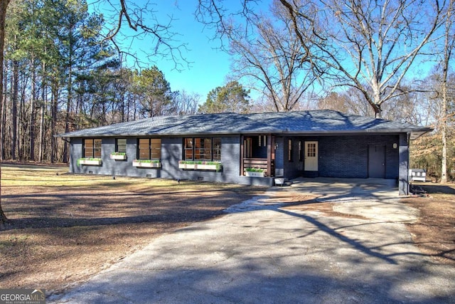 ranch-style house with a carport