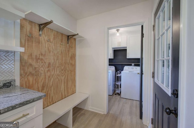 mudroom with independent washer and dryer and light wood-type flooring