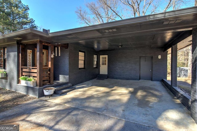 view of front of home with a carport