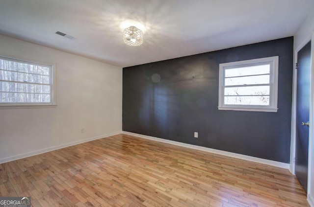 unfurnished room featuring light wood-type flooring