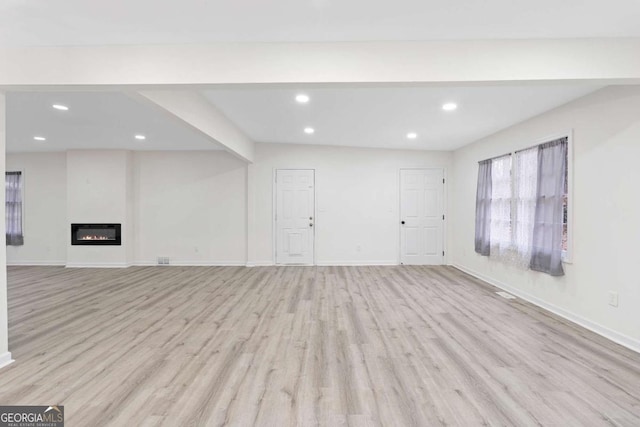 unfurnished living room featuring light hardwood / wood-style flooring