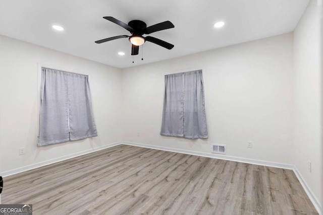 unfurnished room with light hardwood / wood-style floors and ceiling fan