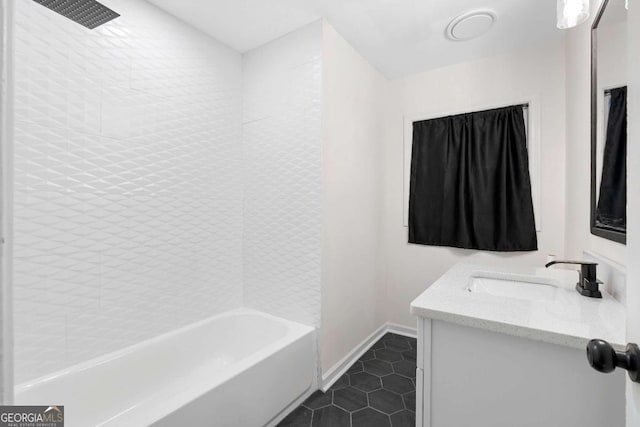 bathroom with shower / bathing tub combination, tile patterned floors, and vanity