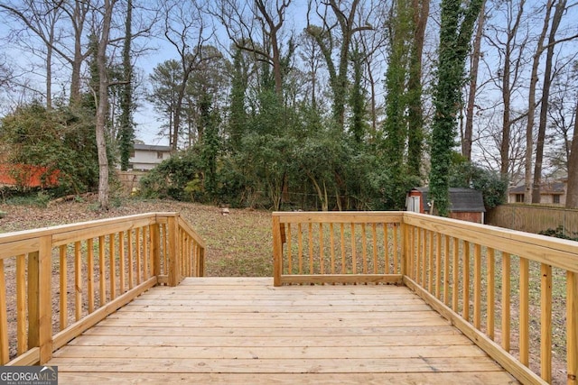 wooden terrace with a shed