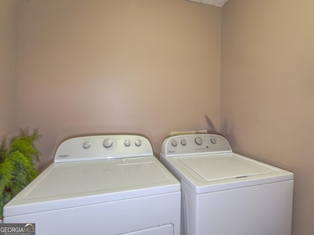 washroom with washer and dryer