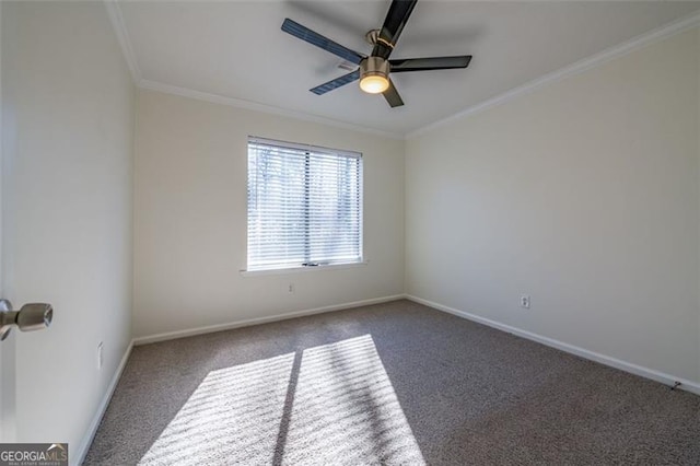 carpeted empty room featuring crown molding and ceiling fan