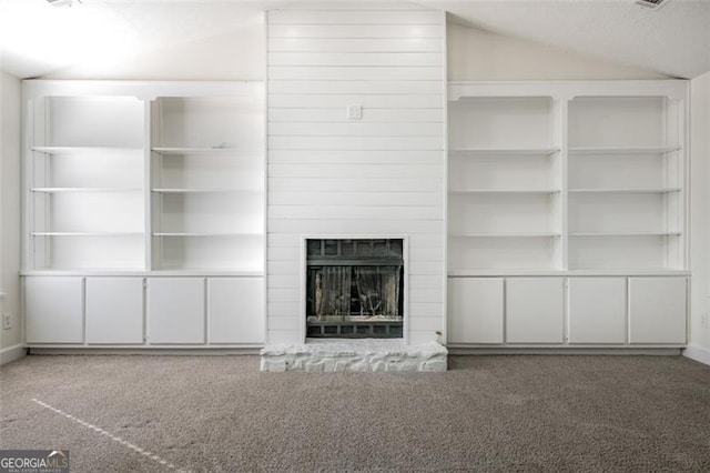 unfurnished living room with lofted ceiling and carpet