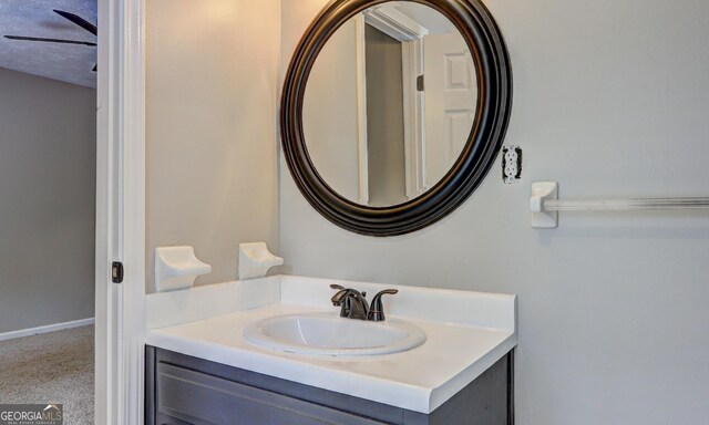 bathroom featuring vanity and a textured ceiling