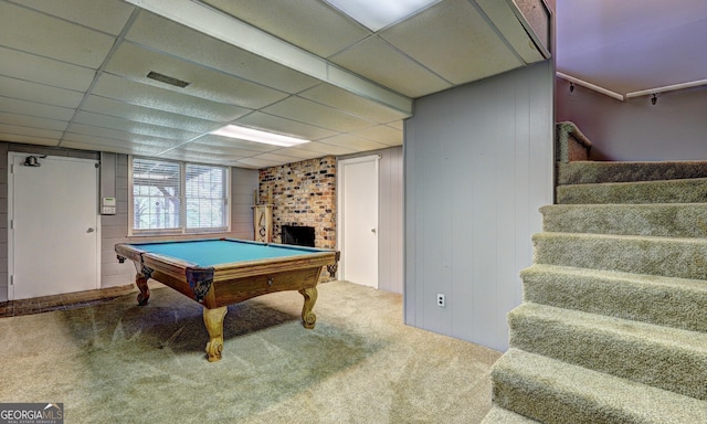 rec room featuring a drop ceiling, pool table, a fireplace, and carpet