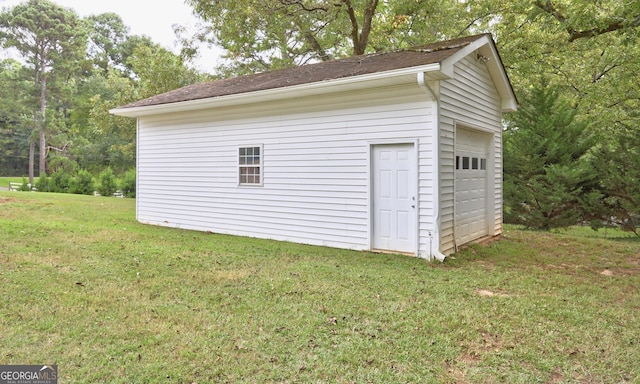 garage with a lawn