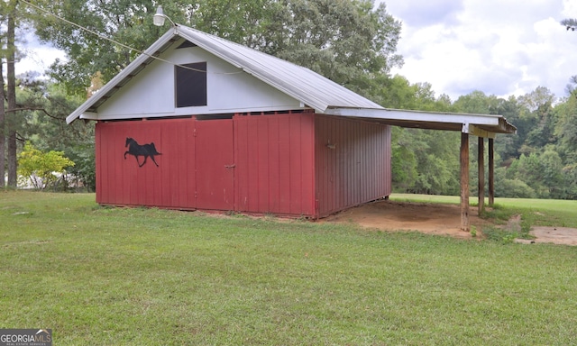 view of outdoor structure with a lawn