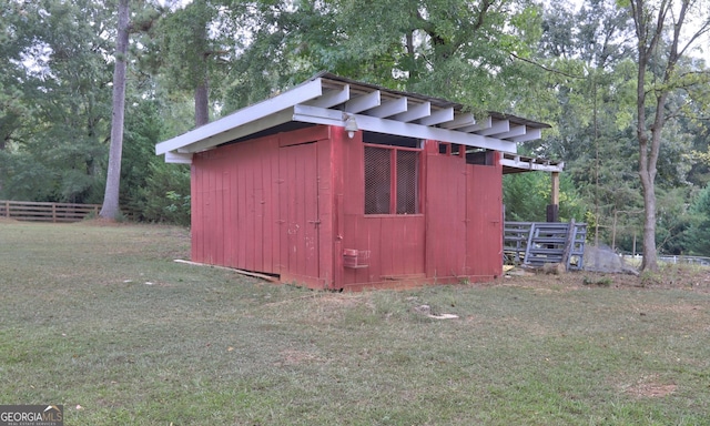 view of outdoor structure with a lawn