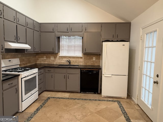 kitchen featuring vaulted ceiling, sink, gray cabinetry, backsplash, and white appliances