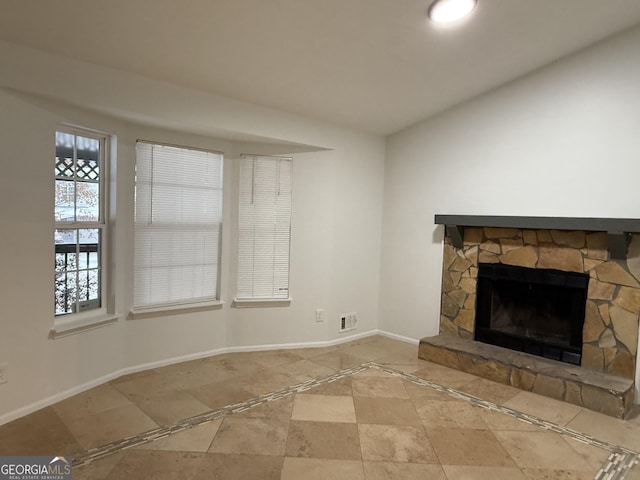 unfurnished living room featuring a fireplace