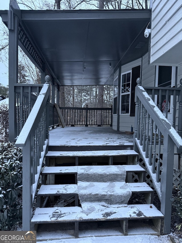 view of snow covered deck