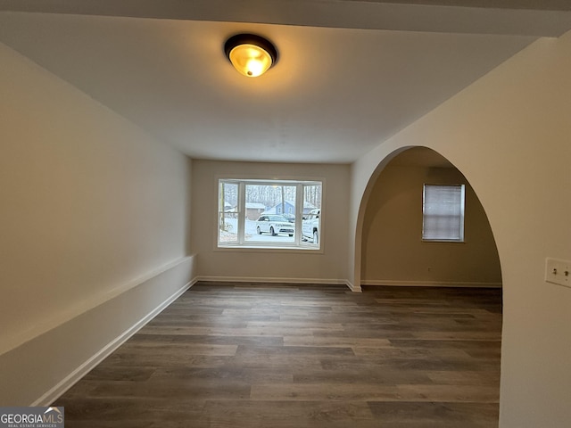 unfurnished room with dark hardwood / wood-style floors