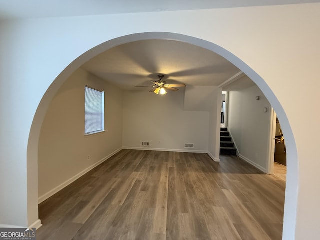 interior space with wood-type flooring and ceiling fan