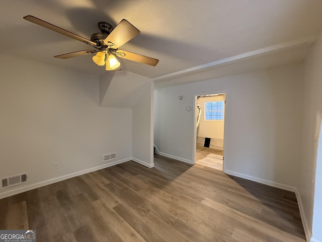 spare room with hardwood / wood-style flooring and ceiling fan