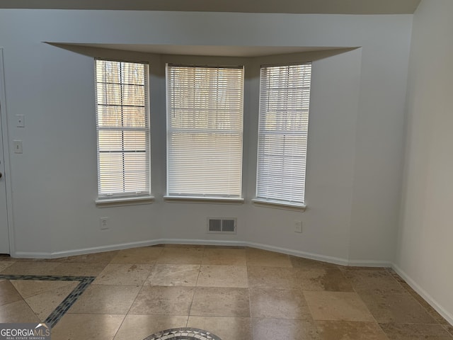 unfurnished dining area featuring a healthy amount of sunlight