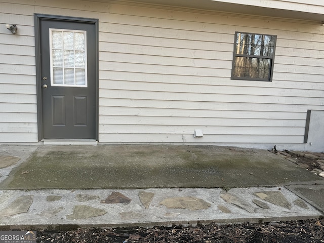 entrance to property with a patio area