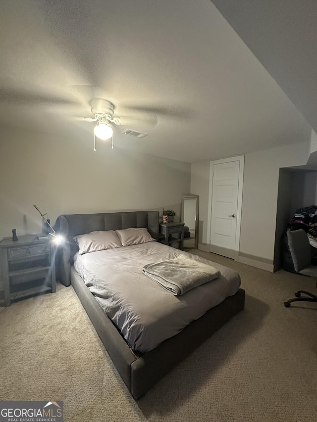 carpeted bedroom with ceiling fan